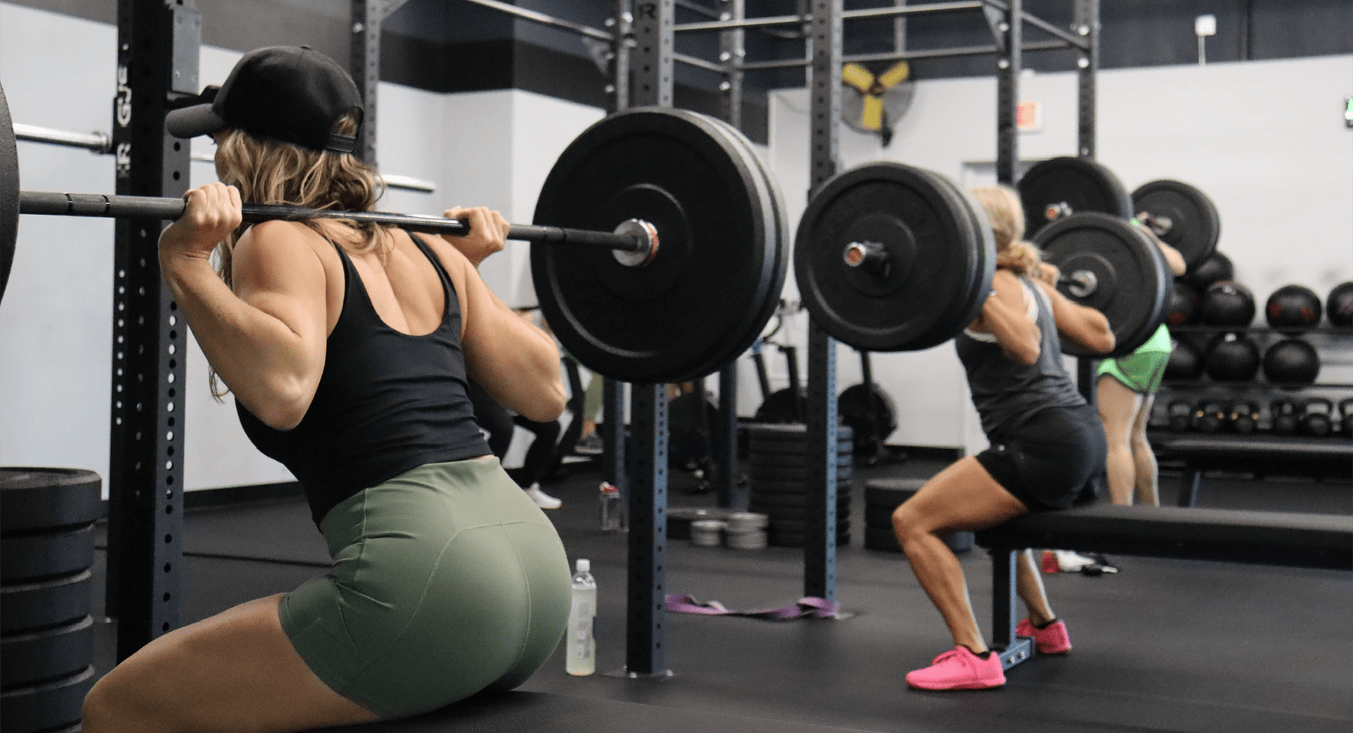 women squatting at Fit One Five